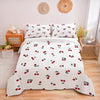 White duvet cover set with a red cherry print featuring scattered cherries and green leaves.