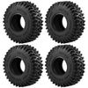 A set of four black mud terrain rubber tires for RC crawlers, showing the tread pattern and mounting holes.