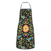 A black apron with a vibrant Mexican floral pattern featuring pink, yellow, and green flowers and leaves.