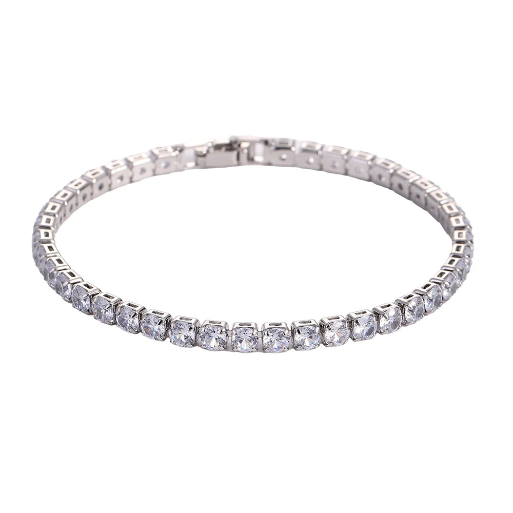 A silver tennis bracelet set with clear, round-cut cubic zirconia stones.