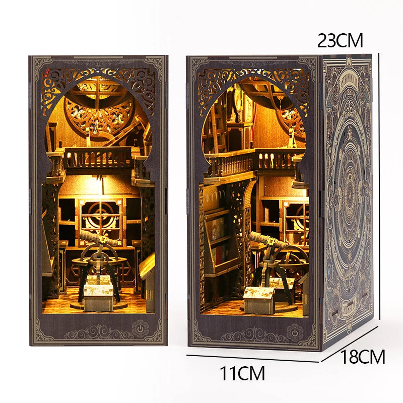 A wooden book nook kit featuring an elaborate miniature scene with LED lighting and detailed architecture.
