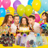 A collection of white organza drawstring bags for gifts and party favors displayed on a yellow surface.