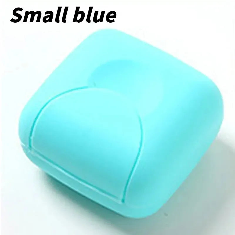 A small blue portable soap holder with a lid shown from above.