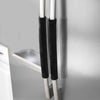 A close-up of two oil-proof refrigerator handle covers with black fabric grips hanging on a light gray cabinet.