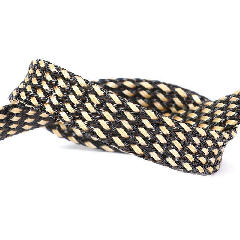 A close-up of a black and tan braided cable sleeve for flexible wire protection.