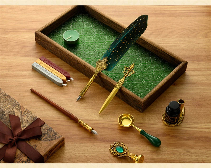 A vintage calligraphy fountain pen set with a wax seal stamp kit displayed in a wooden box on a wooden surface.