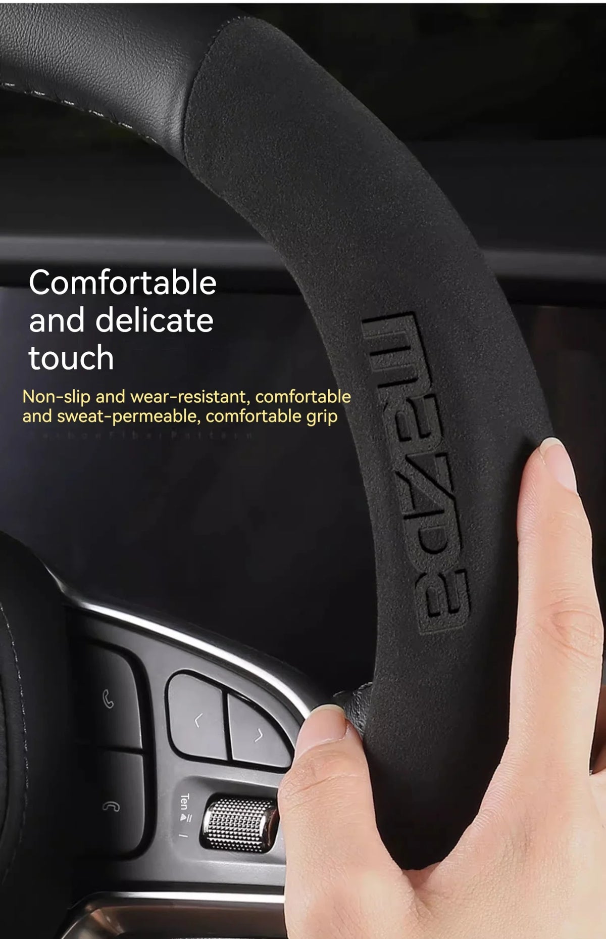 A hand grips a black steering wheel cover, highlighting its comfortable and delicate touch features.