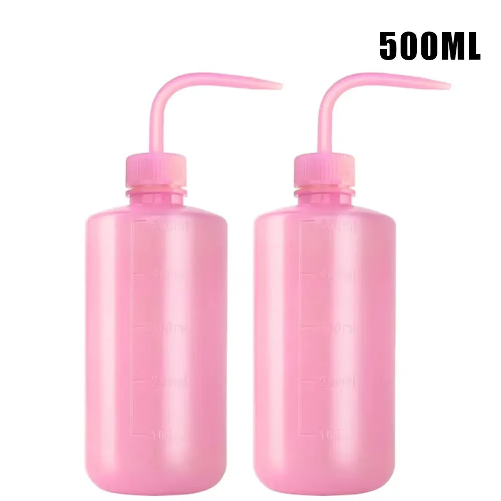 Two pink 500ml tattoo squeeze bottles with precision tips