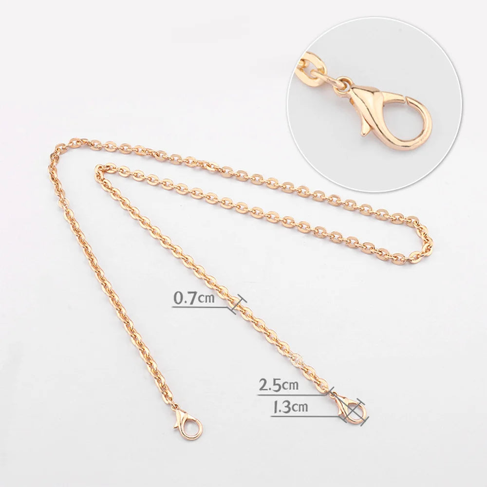 Gold-toned metal purse chain with adjustable buckles shown next to a separate link and a finished piece.