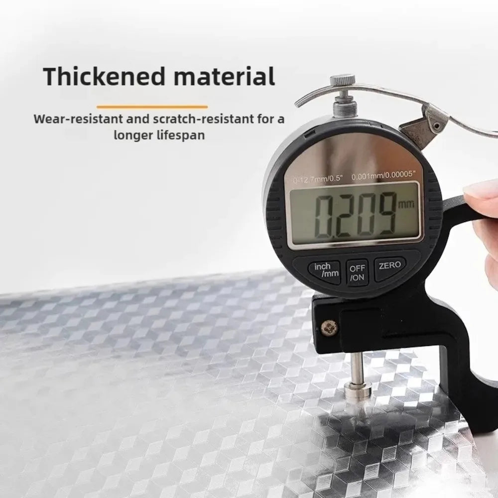 A digital caliper measuring 0.209 mm thickness on a shiny surface.