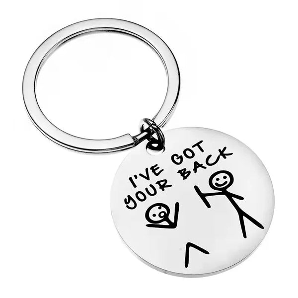 A round stainless steel keychain with the text I've got your back engraved on it.
