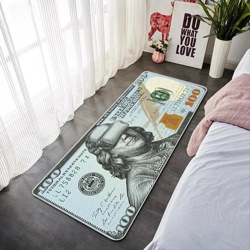 A US $100 banknote lying on a gray floor next to a white bed and sheer curtains.