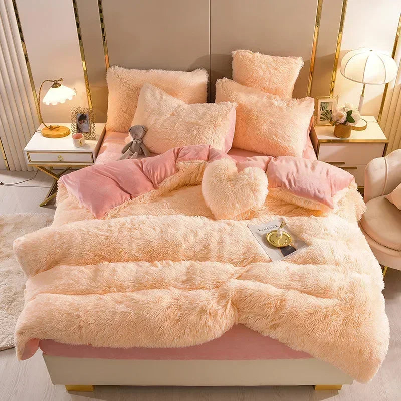 A luxurious pink and cream plush mink velvet duvet cover set displayed on a bed with gold accents.