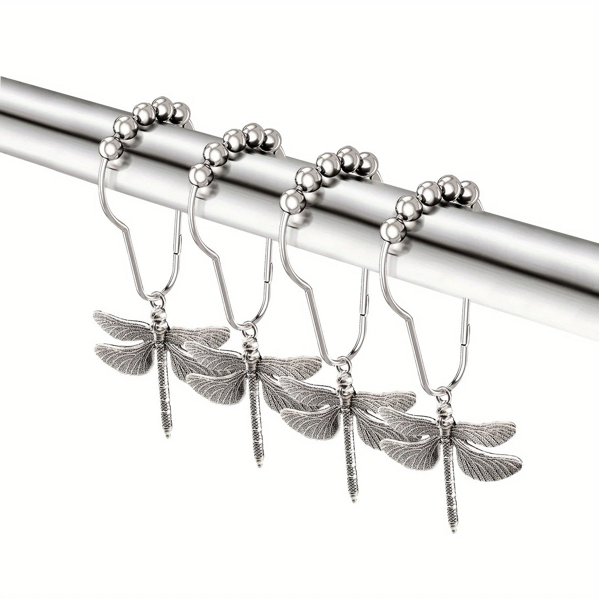 A set of twelve rust-proof metal dragonfly shower curtain hooks hanging from a silver rod.