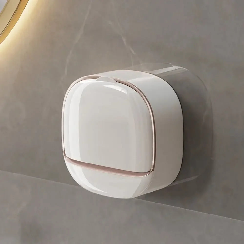 A white wall mounted waterproof soap dish with a rounded design is installed on a gray wall.