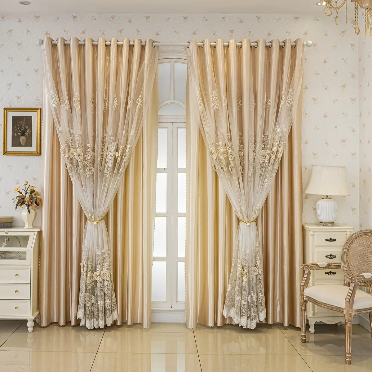 Double layer embroidered beige blackout curtain panels hanging in a bright room.
