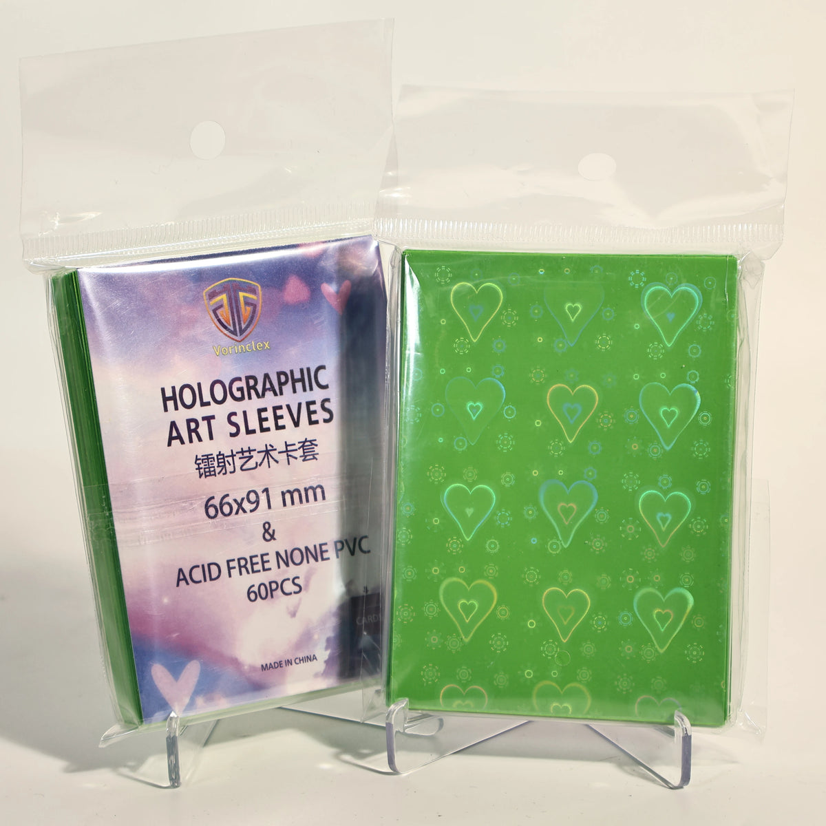 A clear plastic bag contains a pack of 60 holographic heart-shaped art sleeves for trading cards.