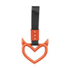 An orange heart-shaped ring drift handle with a black strap.