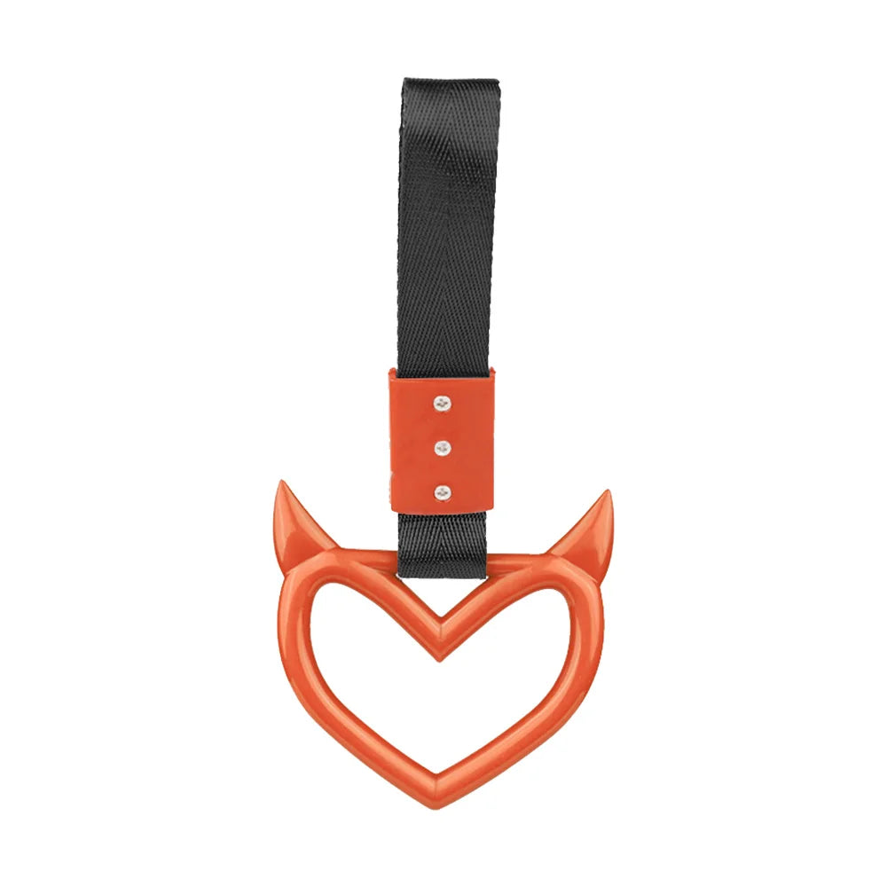 An orange heart-shaped ring drift handle with a black strap.