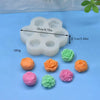 A silicone mold set for making 3D succulent flowers in various colors like orange, pink, and green.