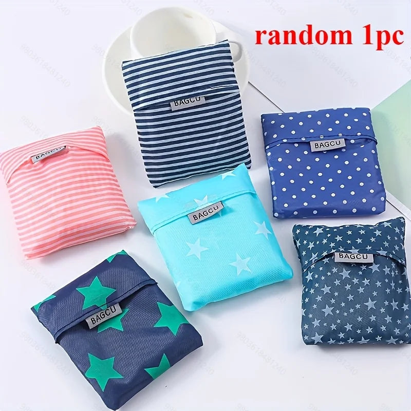 A set of five colorful fabric bags with various patterns and colors, including blue, pink, teal, and green.