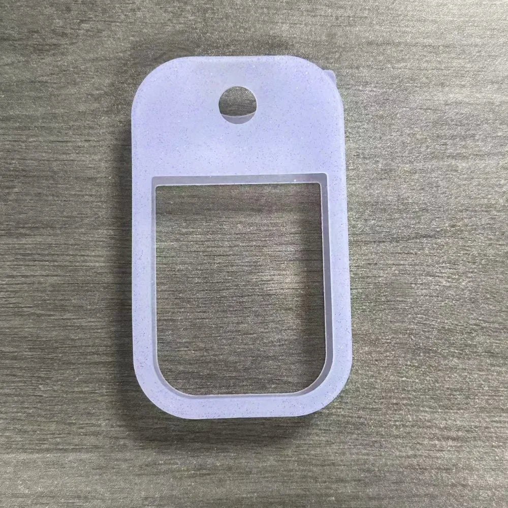 Clear silicone protective case for a hand sanitizer spray with a keyring attached.