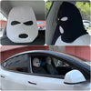 A white ski mask car headrest cover is shown in close-up views and installed in a vehicle interior.