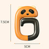 An orange panda-shaped portable bag hook with a black grip, shown against a white background.