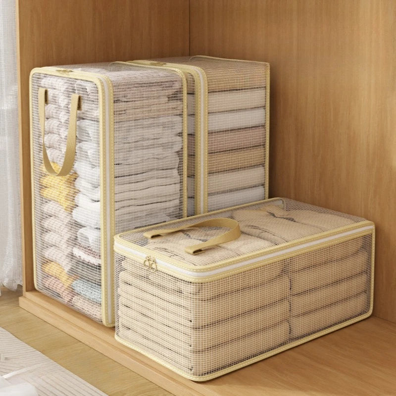 A set of beige mesh storage bags for clothes, blankets, and bedding, displayed in a wooden cabinet.