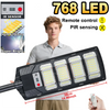 A solar street light with 768 LEDs and PIR sensing is shown being held by a hand.