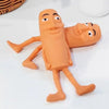 An orange squishy fidget toy shaped like a funny, expressive face for stress relief.