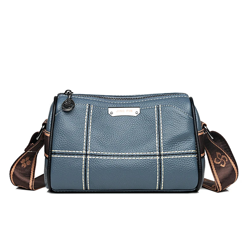 A blue-gray vintage genuine leather women's shoulder bag with brown trim and stitching.