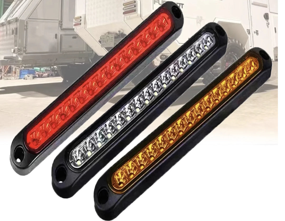 Three long LED light bars showing red, white, and amber signals for trucks and trailers