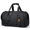 A black large capacity travel duffel bag with padded straps and a zipper pull visible from the top.