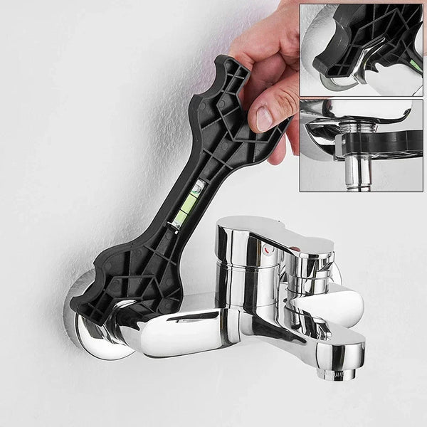 Una mano sostiene una llave de precisión de dos cabezales negra, mostrando su diseño y aplicación.