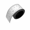 A black magnetic flexible measuring ruler with dual scales shown from the side.