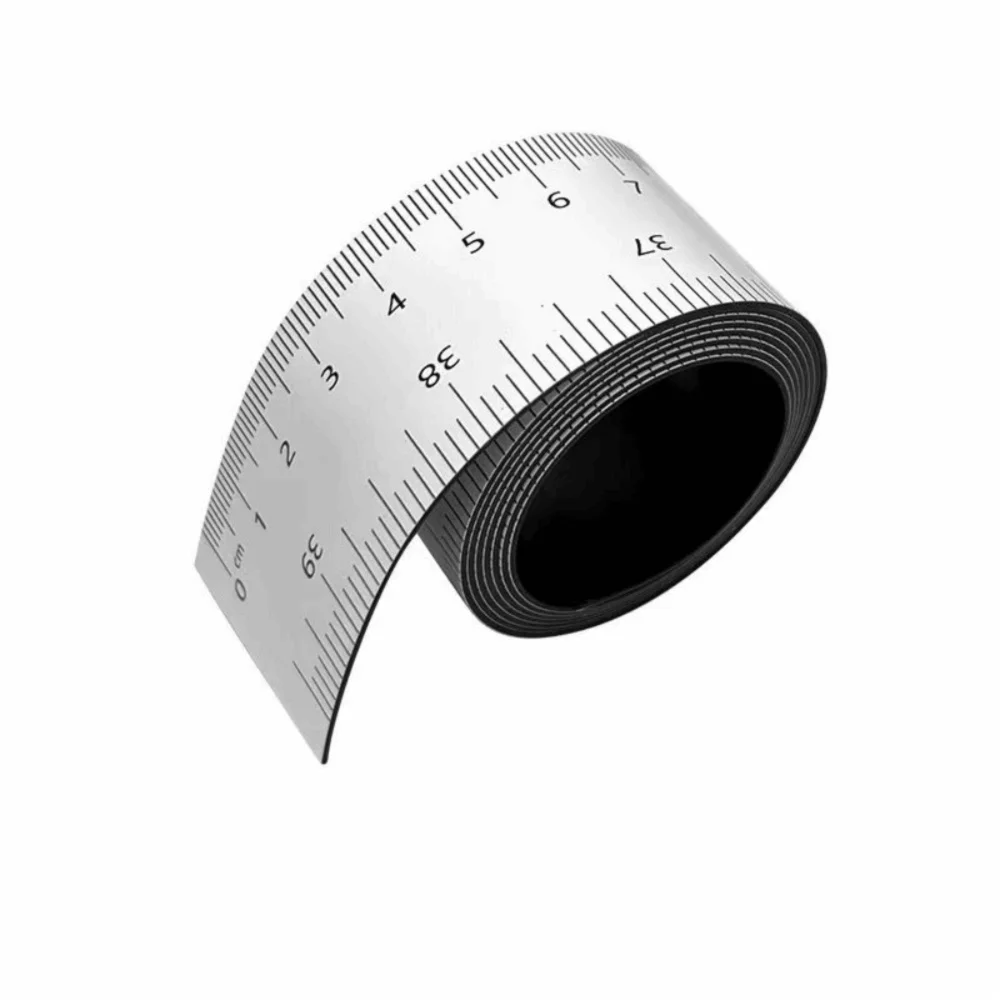 A black magnetic flexible measuring ruler with dual scales shown from the side.