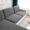 A gray stretch jacquard sofa cover with anti-slip backing shown in a living room setting.