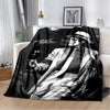 A black and white print of Michael Jackson on a flannel throw blanket.