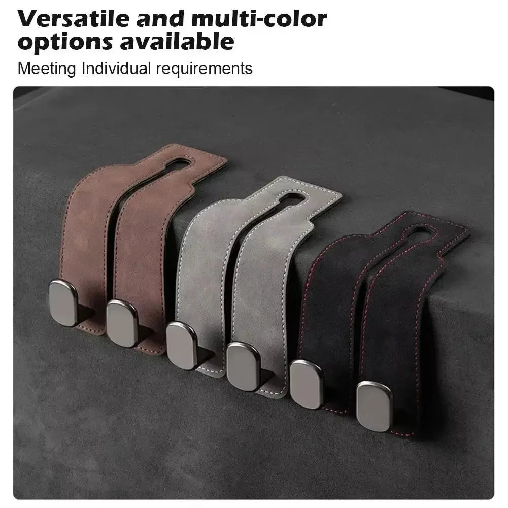 A row of versatile and multi-color suede storage hooks in brown, gray, and black against a dark background.