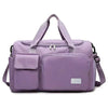 A lavender travel duffel bag with a separate shoe compartment and padded straps.