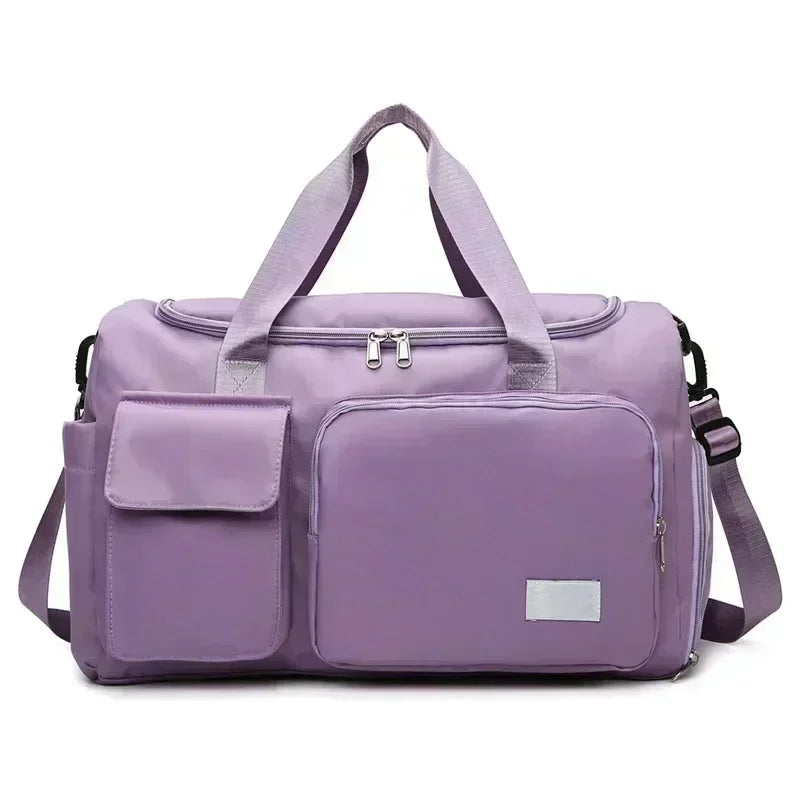 A lavender travel duffel bag with a separate shoe compartment and padded straps.