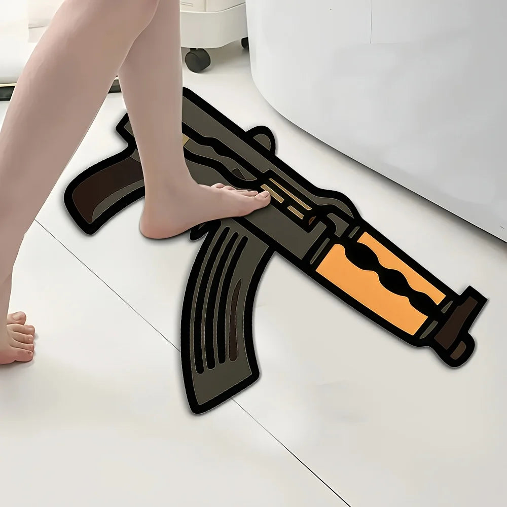 A novelty gun-shaped area rug is shown on a white floor next to a person's bare foot.