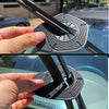 A hand is holding a black wiper arm hole cover, designed to prevent dust and water leaks on a windshield.