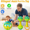 A man is demonstrating a bilingual music rattle toy set with yellow and green spinning rings to a baby.
