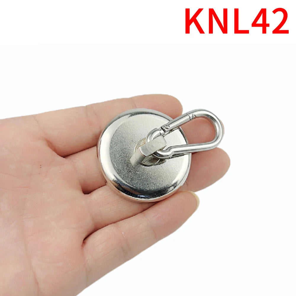 A hand holds a silver neodymium magnetic hook with a swivel carabiner attached.