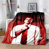 A throw blanket featuring a portrait of Eminem with large text on a red background.
