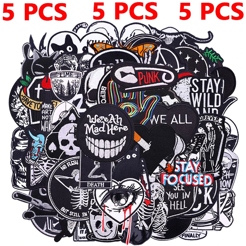 A variety pack of black embroidered punk patches featuring skulls, symbols, and text for DIY clothing customization.
