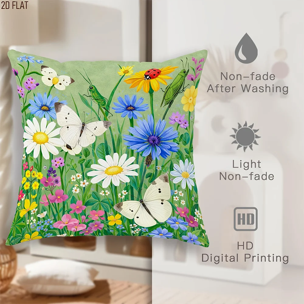 A green throw pillow cover featuring a vibrant floral pattern of white, yellow, and blue wildflowers.