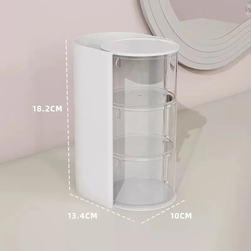 A white clear acrylic hair accessories organizer with three rotating compartments shown on a light surface.
